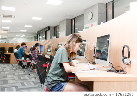 Education scene Students in front of university computers Education scene Students in front of university computers 17681295