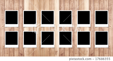 Polaroid photo frame on wood background 17686355