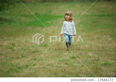 cute alone little girl in park cute alone little girl in park 17688172