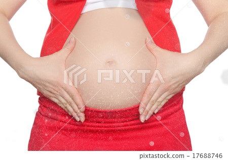 Pregnant woman supports her belly with snow 17688746