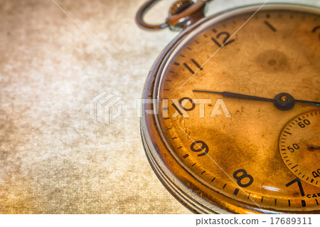 Russian antique pocket watch on brown background 17689311