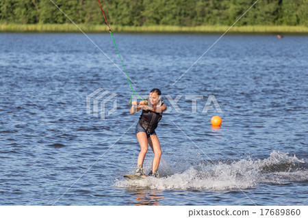 Woman riding wake board 17689860
