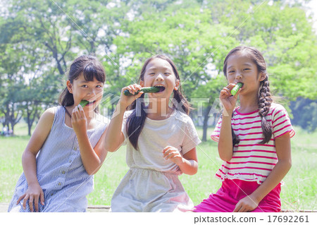 Elementary school student eating cucumbers 17692261