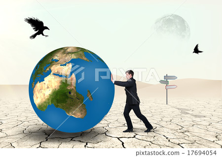Businessman pushes world sphere 17694054