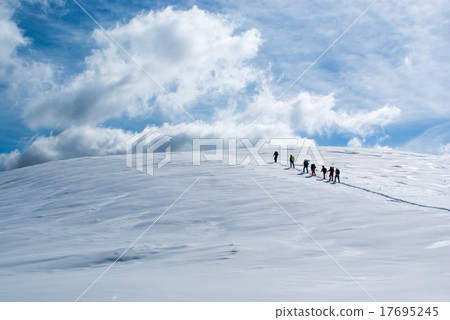 Climbers going on snow Climbers going on snow 17695245