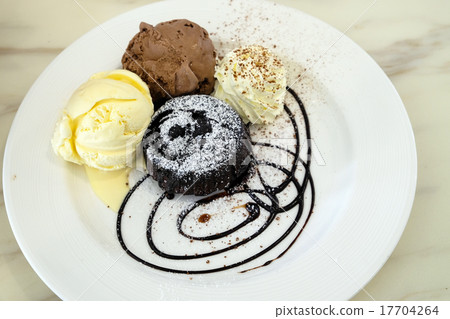 Chocolate lava cake with ice-cream in the dish Chocolate lava cake with ice-cream in the dish 17704264