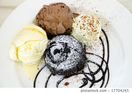Chocolate lava cake with ice-cream in the dish Chocolate lava cake with ice-cream in the dish 17704265