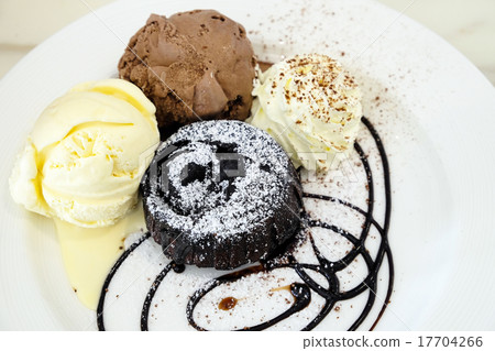 Chocolate lava cake with ice-cream in the dish Chocolate lava cake with ice-cream in the dish 17704266