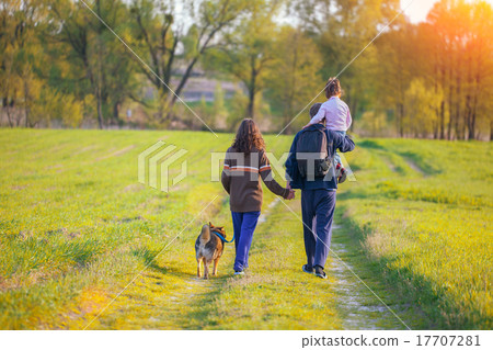 Happy family walking with dog Happy family walking with dog 17707281