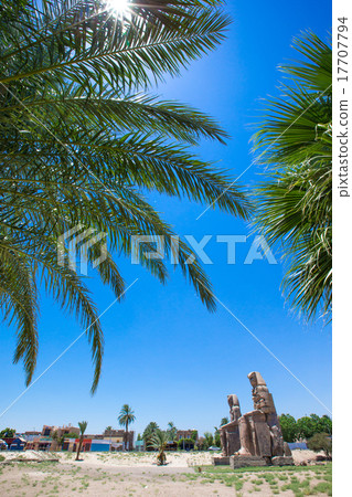 Egypt. Luxor. The Colossi of Memnon - two massive stone statues Egypt. Luxor. The Colossi of Memnon - two massive stone statues 17707794