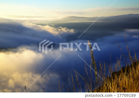 Fog over wooded mountains Fog over wooded mountains 17709189