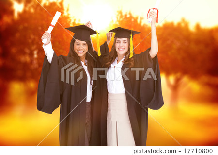 Composite image of two women celebrating their graduation Composite image of two women celebrating their graduation 17710800