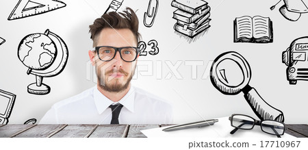 Composite image of geeky young businessman looking at camera Composite image of geeky young businessman looking at camera 17710967