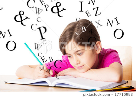 Composite image of cute pupil working at her desk 17710998