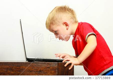 little boy using laptop pc computer at home little boy using laptop pc computer at home 17713869