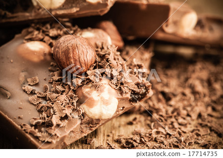 chocolate shavings and pieces on wooden table 17714735