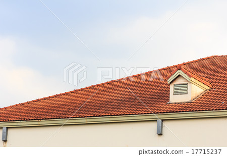 Chimneys on roof of red tiles with blue sky Chimneys on roof of red tiles with blue sky 17715237