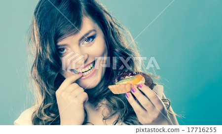 Smiling cute woman holds fruit cake in hand Smiling cute woman holds fruit cake in hand 17716255