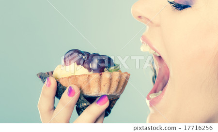 woman face profile open mouth eating cake woman face profile open mouth eating cake 17716256