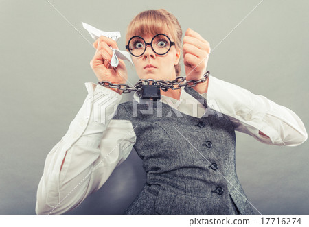 Furious woman with chained hands and contract 17716274
