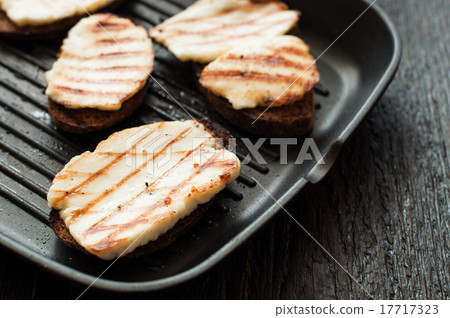 Crostini with fried cheese on the grill Crostini with fried cheese on the grill 17717323