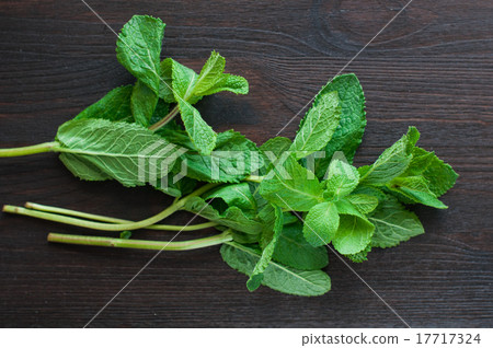 fresh mint leaves on the wooden background 17717324