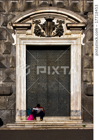 homeless reading a newspaper 17718453