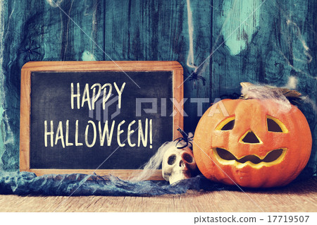 pumpkin and text happy halloween in a chalkboard 17719507