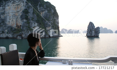 A woman who enjoys a strange rock on a cruise in Halong Bay, Vietnam 17721217