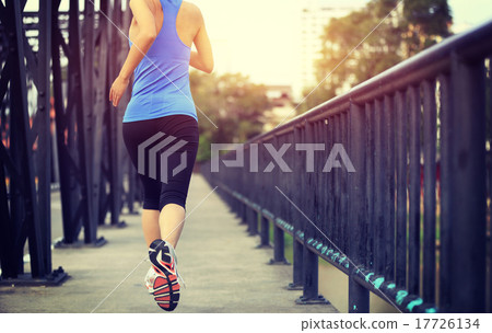 Runner athlete running on iron bridge.   17726134