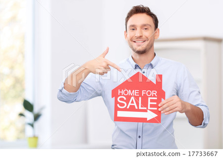 Pleasant realtor holding card  17733667