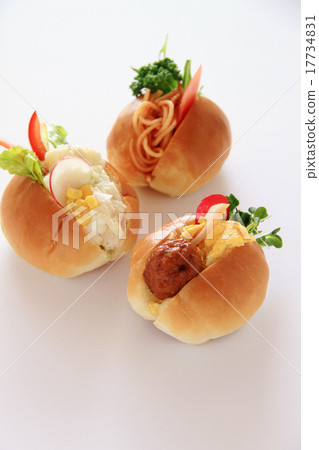 A vertical cut enjoying roll buns with sandwich A vertical cut enjoying roll buns with sandwich 17734831