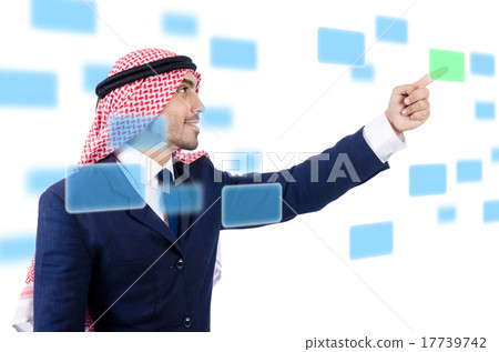 Arab man pressing virtual buttons Arab man pressing virtual buttons 17739742
