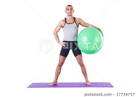 Man with swiss ball doing exercises on white Man with swiss ball doing exercises on white 17739757