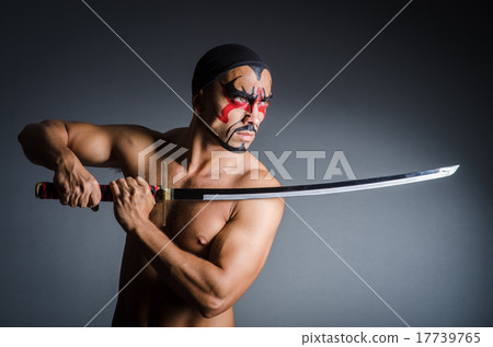 Man with sword and face paint Man with sword and face paint 17739765