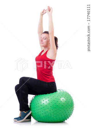 Young woman with ball exercising on white 17740111