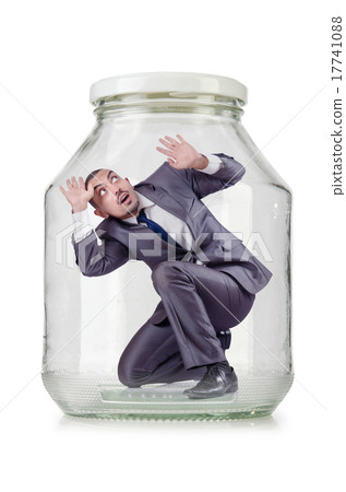 Young businessman in glass jar Young businessman in glass jar 17741088