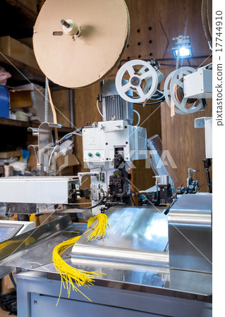 Manufacturing facility. Crimped wires on machine 17744910