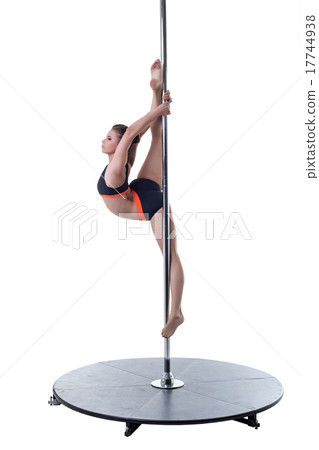 Strength and grace of pole dance. Cute girl posing 17744938