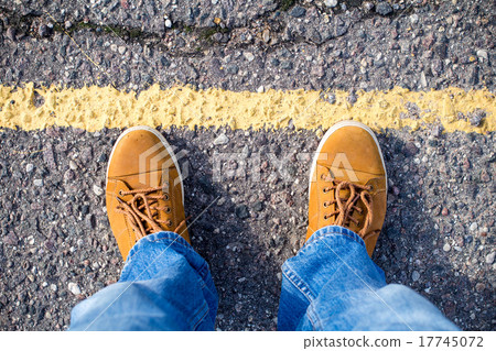 Top view of male sneakers on the asphalt road Top view of male sneakers on the asphalt road 17745072