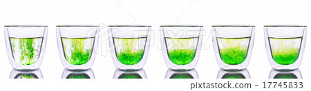 Green color spread in glass of water 17745833