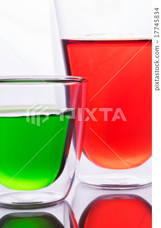 Glass of red and green water 17745834