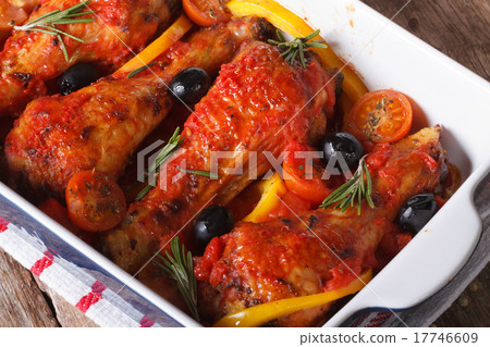 Chicken legs in tomato sauce in a baking dish Chicken legs in tomato sauce in a baking dish 17746609