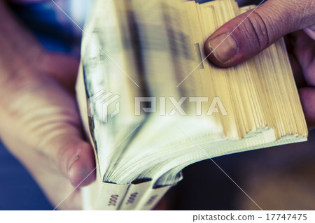 pack of money - big pile of banknotes in hand 17747475