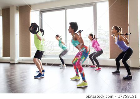group of people exercising with barbell in gym 17759151