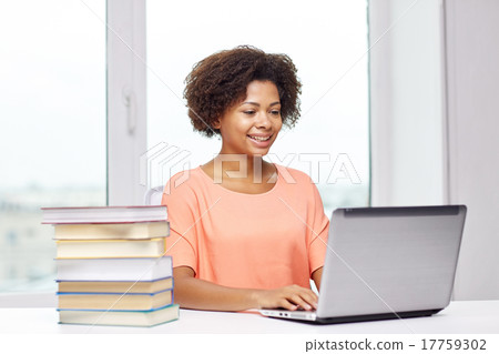 happy african american woman with laptop at home happy african american woman with laptop at home 17759302