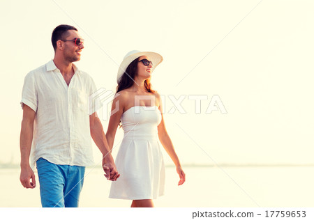 smiling couple walking outdoors 17759653
