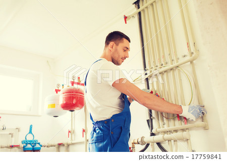 builder or plumber working indoors 17759841