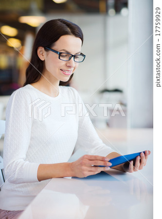 smiling woman with tablet pc at cafe smiling woman with tablet pc at cafe 17759929
