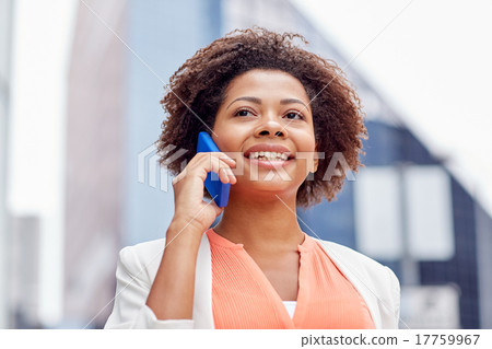 Stock Photo: happy african businesswoman calling on smartphone